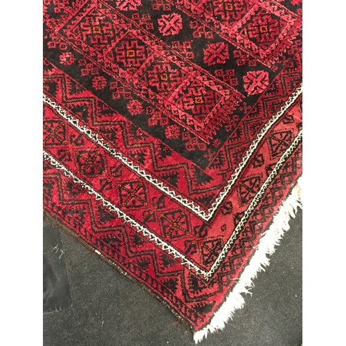 480 - Afghan carpet in pink and blue pattern 214x114cm.