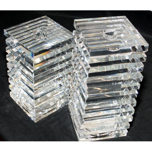 47 - Pair of very heavy crystal glass candlesticks in ribbed square form, the tallest being 22cms high