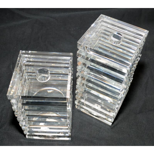 47 - Pair of very heavy crystal glass candlesticks in ribbed square form, the tallest being 22cms high