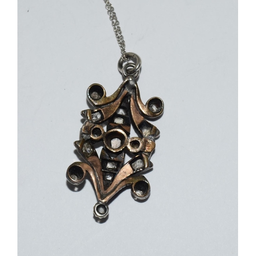 541 - Victorian silver and gold diamond pendant, old cut diamonds of approx 1ct set with a 9ct gold chain