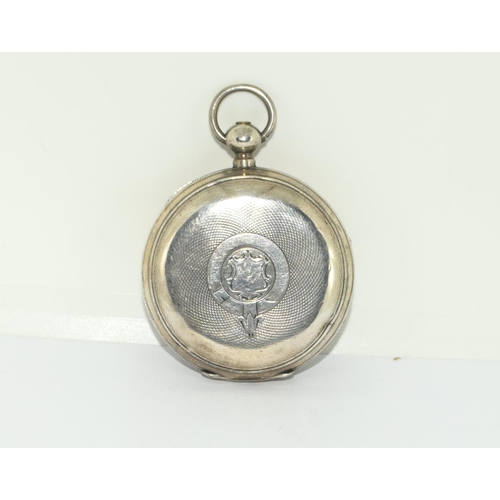 60 - A silver pocket watch with silver double Albert watch chain.