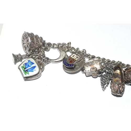 13 - Silver charm bracelet and 15+ charms  70g