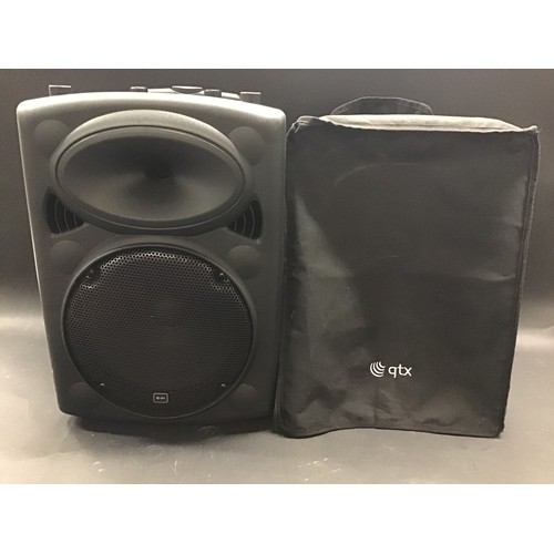12 - QTX PORTABLE SPEAKER SYSTEM. Speaker system with built in amp and mixer. Comes complete with origina... 