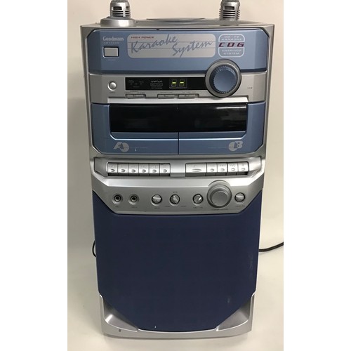 169 - GOODMANS KARAOKE MACHINE. This machine is model No. XB17CDG. Come with 2 microphones and plays the c... 