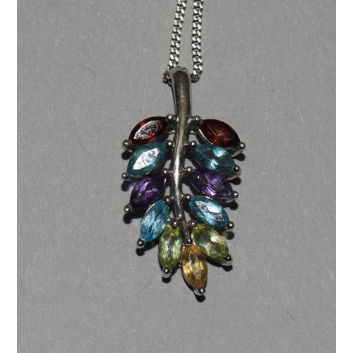 324 - A natural multi gemstone W/G 925 silver pendant.