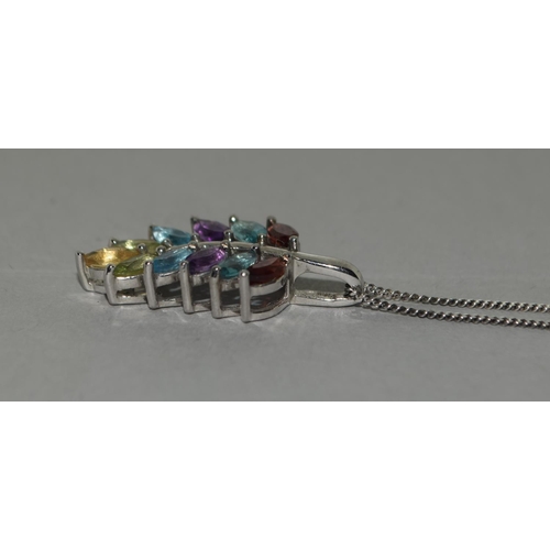 324 - A natural multi gemstone W/G 925 silver pendant.