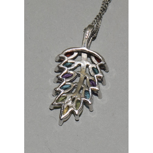 324 - A natural multi gemstone W/G 925 silver pendant.