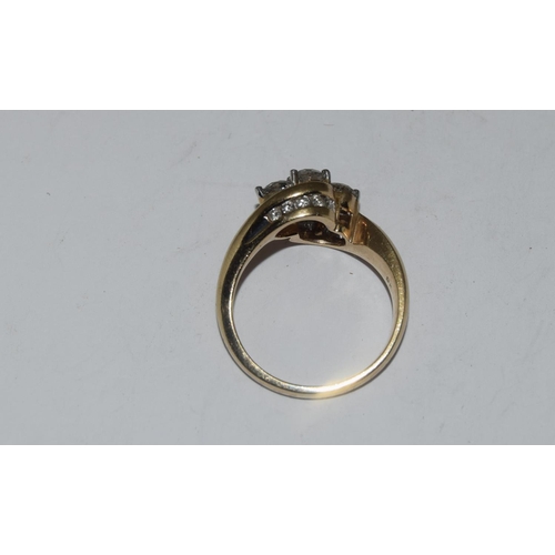 391 - 9ct gold ladies diamond 3 stone twist ring with diamonds set to shoulders hall marked in ring as 1 c... 