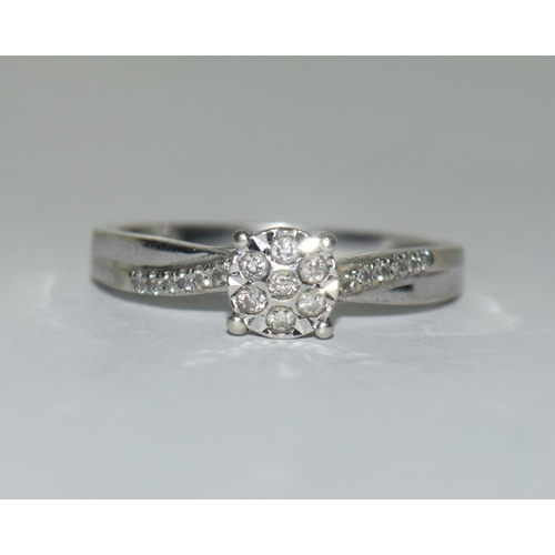 310 - 9ct white gold ladies Diamond ring size T