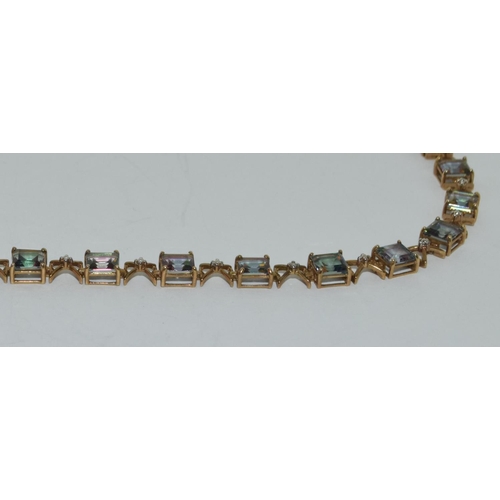 412 - 9ct gold Mystic topaz line bracelet