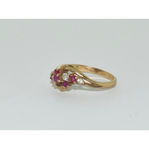 361 - 9ct gold ladies diamond and ruby twist ring size N