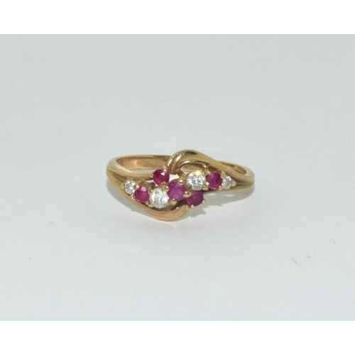 361 - 9ct gold ladies diamond and ruby twist ring size N