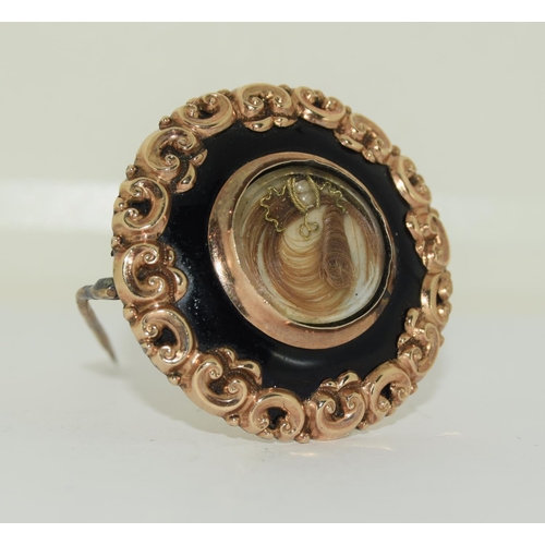 320 - Gold Mourning brooch set with black jet and scrolled decoration inscribed 1881 with gold on inside a... 