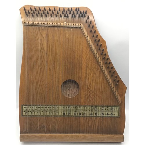 377 - A VINTAGE ZITHER. An antique 'Piano Chord' Zither, in original  case with key for tuning.