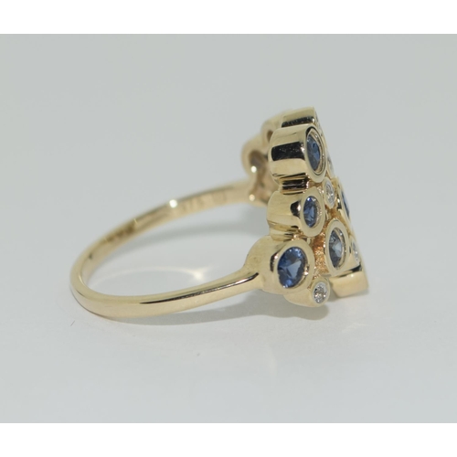 328 - A 9ct gold blue and white sapphire ring Size P