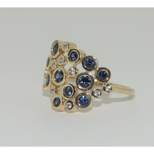 328 - A 9ct gold blue and white sapphire ring Size P