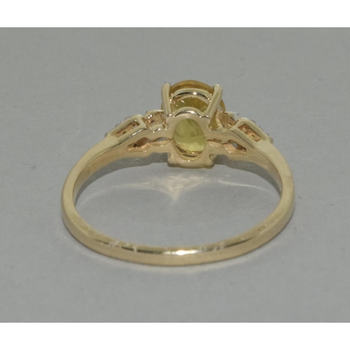 415 - A 9ct gold yellow sapphire and diamond ring Size R