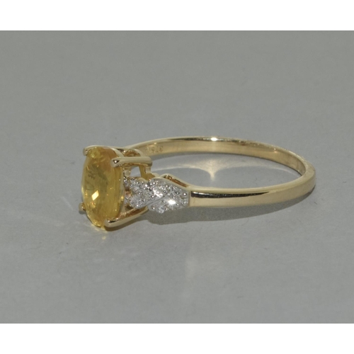 415 - A 9ct gold yellow sapphire and diamond ring Size R