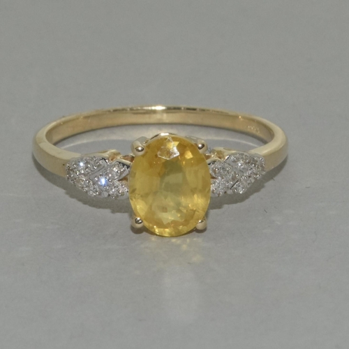 415 - A 9ct gold yellow sapphire and diamond ring Size R