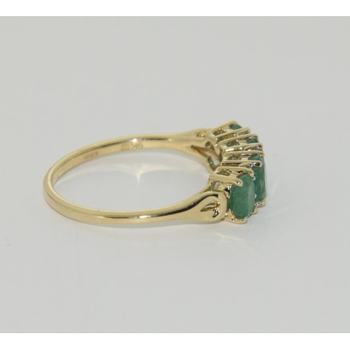 425 - 9ct Gold 4 stone Emerald ring. Size P 1/2.