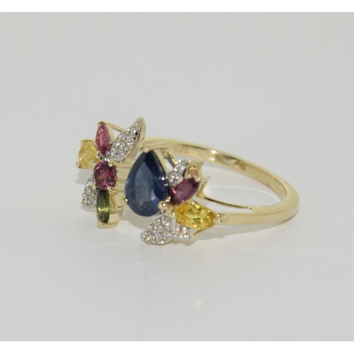 413 - 9ct Gold coloured sapphire ring. Size N 1/2.