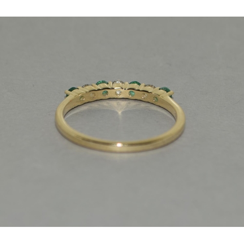 335 - A 9ct gold emerald white sapphire ring Size P 1/2.