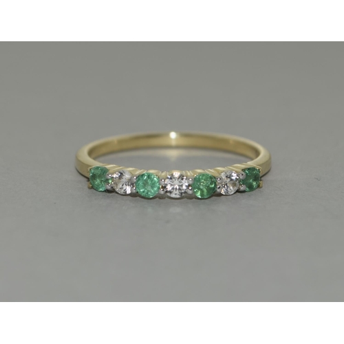 335 - A 9ct gold emerald white sapphire ring Size P 1/2.