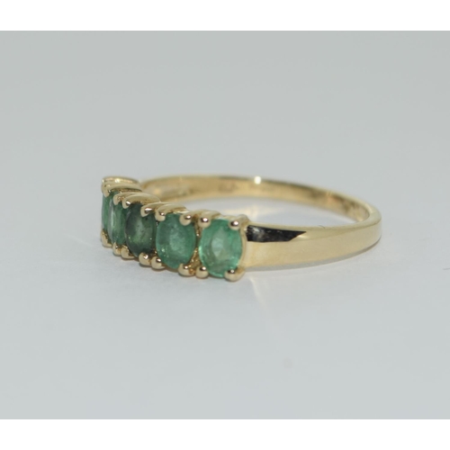 405 - A 9ct gold emerald five stone ring Size L