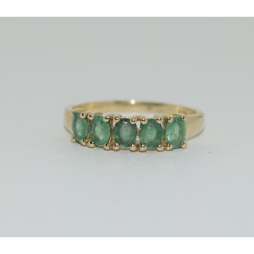 405 - A 9ct gold emerald five stone ring Size L