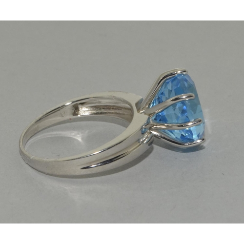 445 - A silver Blue Topaz ring, Size