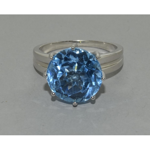 445 - A silver Blue Topaz ring, Size