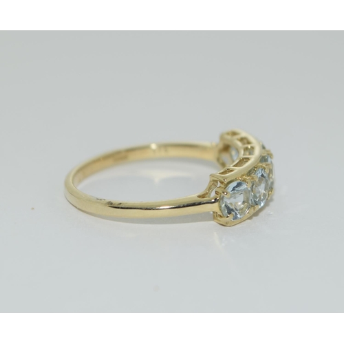 493 - A 9ct gold aquamarine 5 stone ring Size N