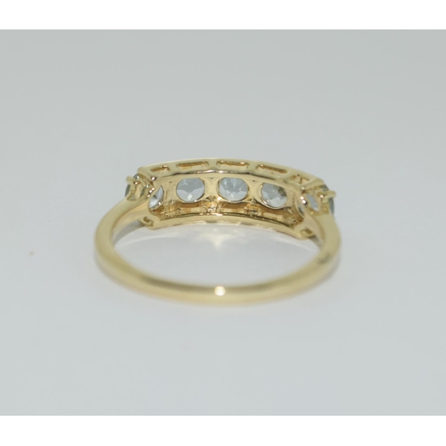 493 - A 9ct gold aquamarine 5 stone ring Size N