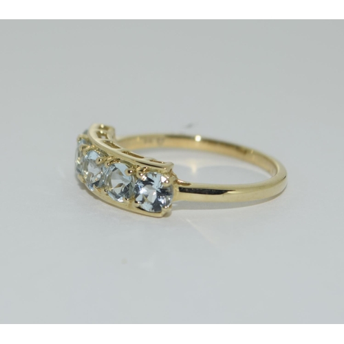 493 - A 9ct gold aquamarine 5 stone ring Size N