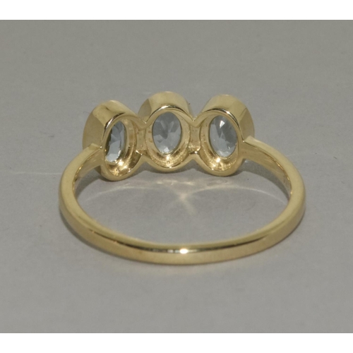 458 - A 9ct gold aquamarine three stone ring Size P