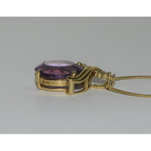 488 - 18ct Gold Amethyst Diamond pendant on 9ct Gold chain.