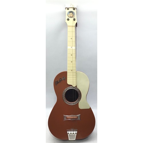 379 - 1950S SELCO ELVIS PRESLEY GUITAR. This is a 4 string guitar with 17 frets. There is slight damage to... 