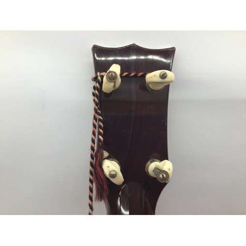 379 - 1950S SELCO ELVIS PRESLEY GUITAR. This is a 4 string guitar with 17 frets. There is slight damage to... 