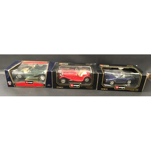 415 - Burago 1/18 scale and Corgi boxed models to include Porsche, Jaguar and Guinness Past & Present mode... 