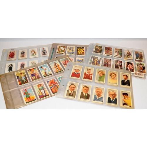 21 - Good quantity of tea and cigarette cards held within a number of albums. Lot includes a large number... 