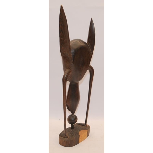 25 - Tribal art hardwood abstract figure c/w hardwood carved elephant. Figure 51cms tall