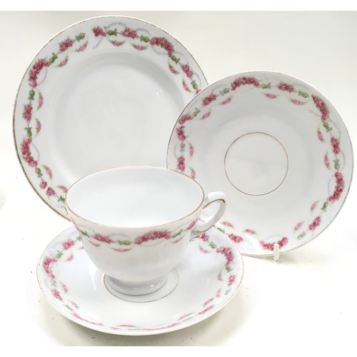 79 - Bavarian porcelain tea service with pink rose pattern. Teacup, saucer and side plate for 6 settings.... 