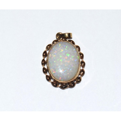 302 - Two 9ct gold and opal pendants