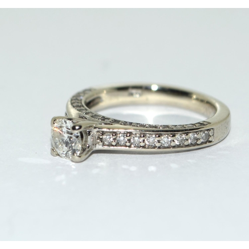 401 - A Diamond solitaire approx 0.50 point with diamond shoulders and diamond sides set in 14ct white gol... 