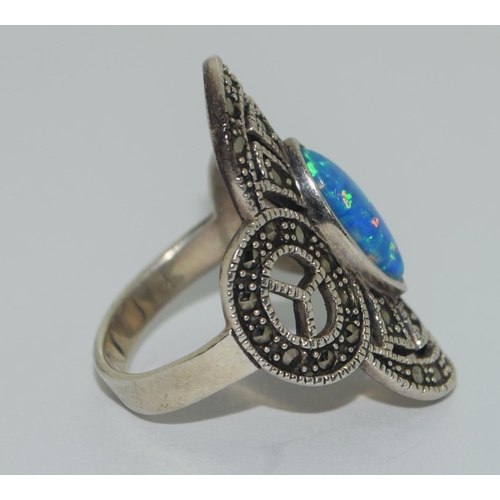 400 - A silver opal and marcasite ring Size O