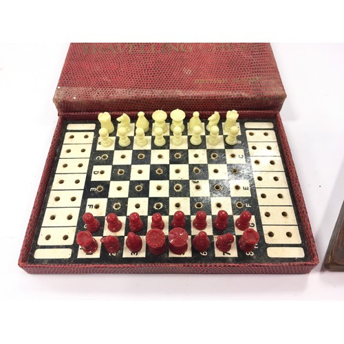 61 - Vintage travelling chess set together with a vintage cribbage board (2).