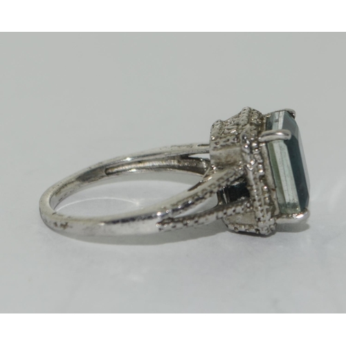 339 - 925 silver Green square set stone halo style ring. Size Q.