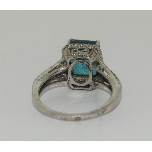 339 - 925 silver Green square set stone halo style ring. Size Q.