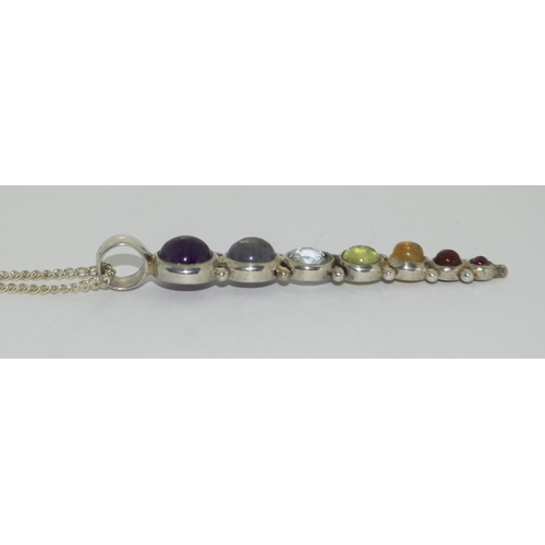 428 - Silver multi stone drop pendant.