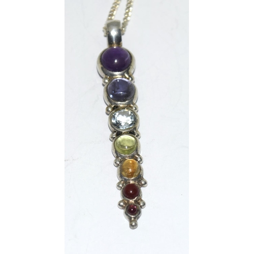 428 - Silver multi stone drop pendant.